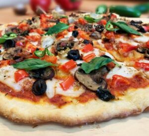 Delicious plant-based comfort food alternatives like vegan pizza on a plate.